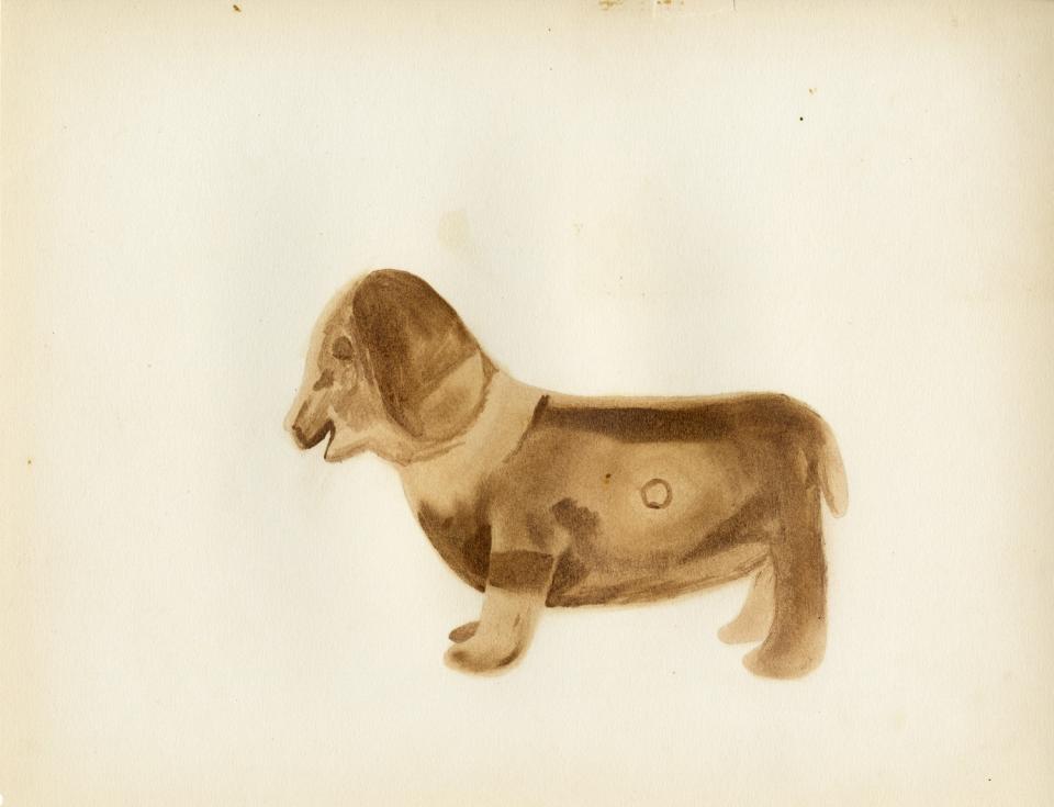 Painting of a black-on-buff dog shaped vessel