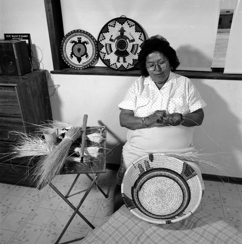 Madeline Lamson splicing mooho (yucca) for a coiled basket