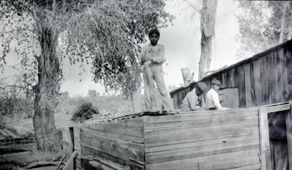 Boys Work on a Roof