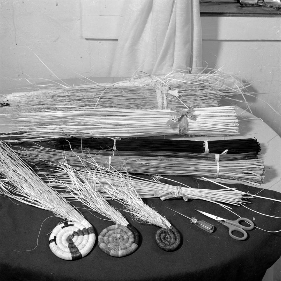 Three coiled plaque centers started  by Joyce Ann Saufkie with bundles of galleta grass