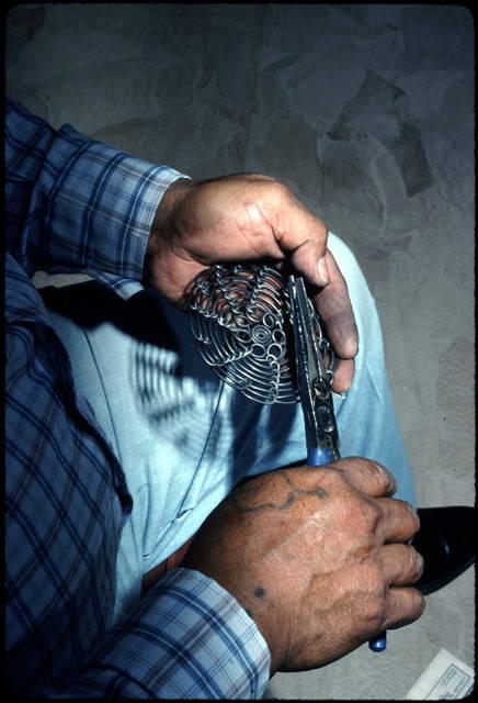 Albert uses pliers to complete one stand of wire_image #4.jpg