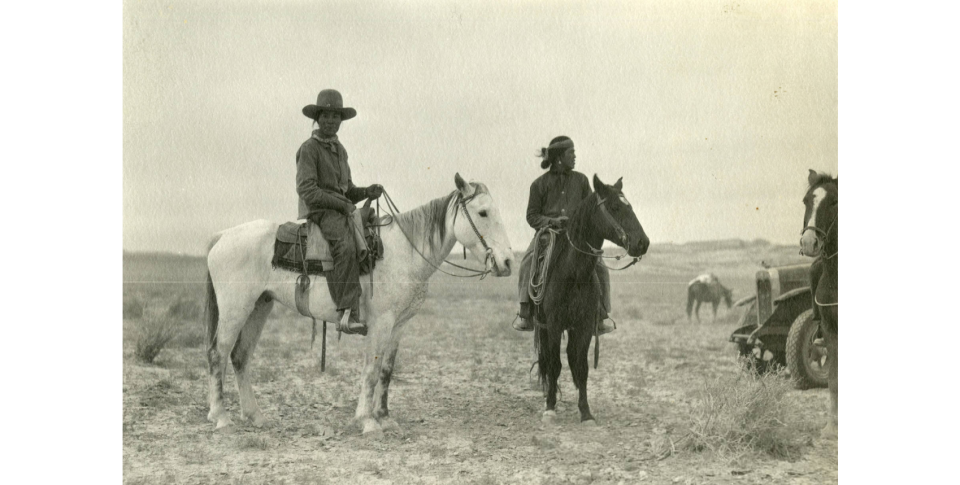 Navajo men on horseback