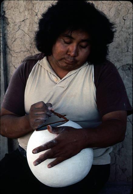 Rupert paints one of his pots with hematite_image #19.jpg